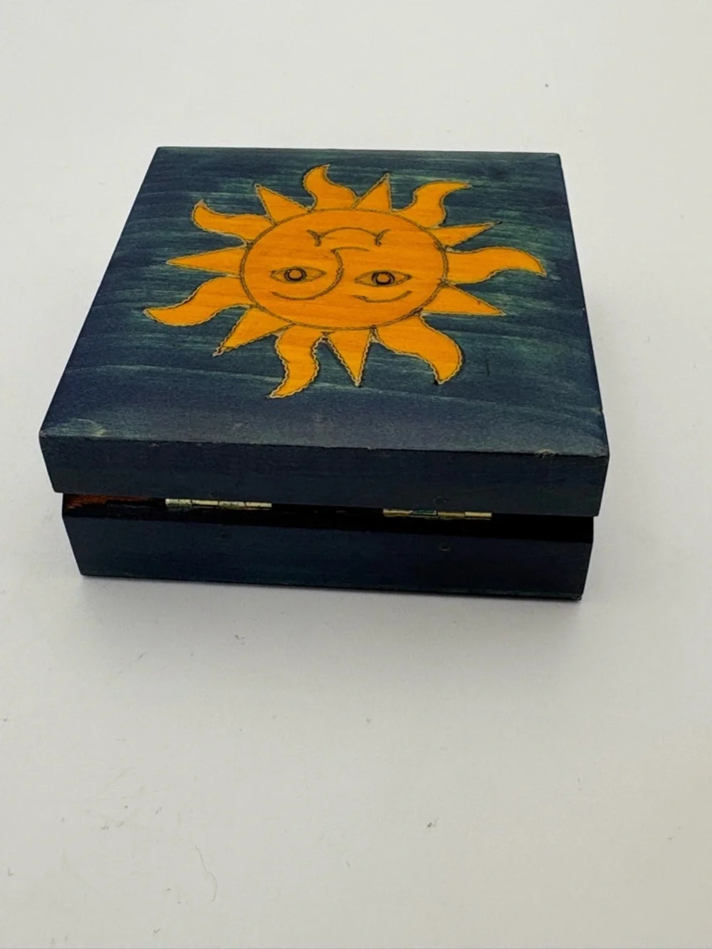 Bright Yellow Sun on Deep Blue Wooden Box